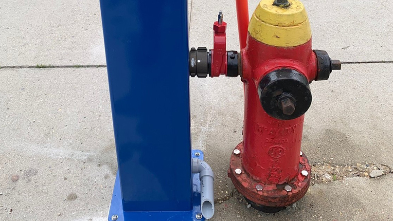Hydration stations are connected to fire hydrants to provide a continuous supply of clean drinking water.